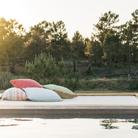 Soak up the sun and catch up on your book on this comfortable seating space