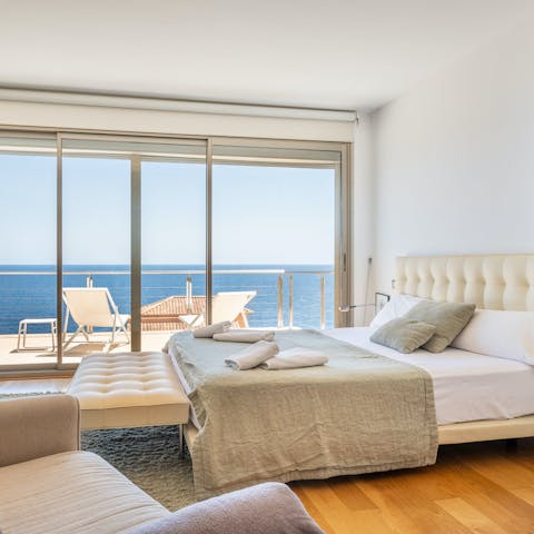 Wake up each morning in the main bedroom to sparkling sea views