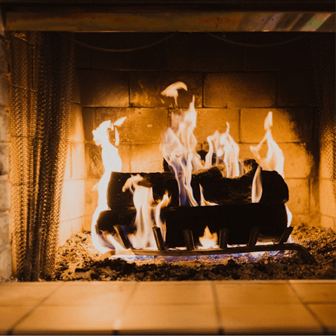 Get cosy by the fire with a glass of wine after a day in the snow