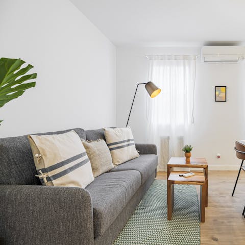 Kick back in the stylish living room with a glass of Spanish wine after a day of exploring the city