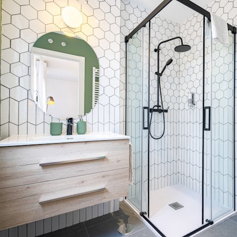 Start mornings with a relaxing soak under the bathroom's rainfall showers