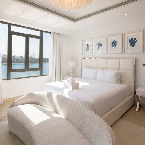 Wake up to gorgeous views of the Gulf and the city skyline