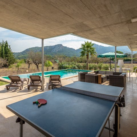 Enjoy a spot of table tennis on the covered terrace