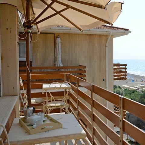 Sip your morning coffee amid the warm sea breeze of the balcony