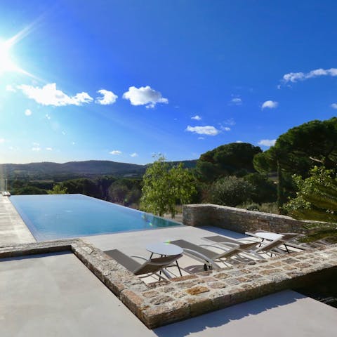 Relax by the infinity pool and take in the sweeping countryside views