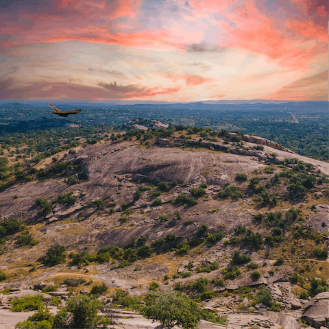 Explore the rugged beauty of Enchanted Rock State Natural Area, a ninety-minute drive