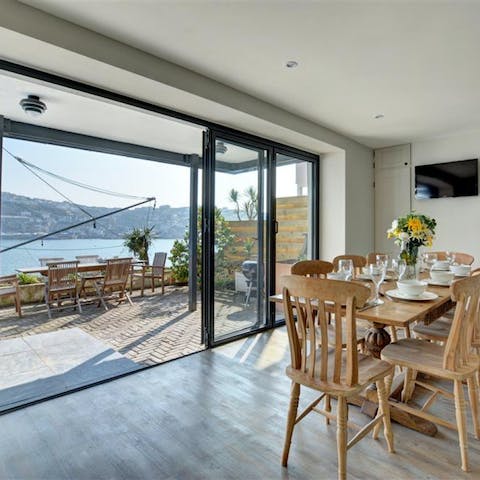 Open the glass doors, sit on the terrace, take in the sweeping sea views