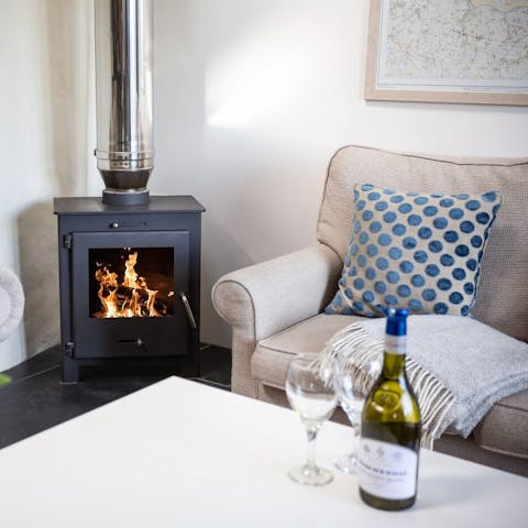 Cosy up by the wood burner with a warming glass of red