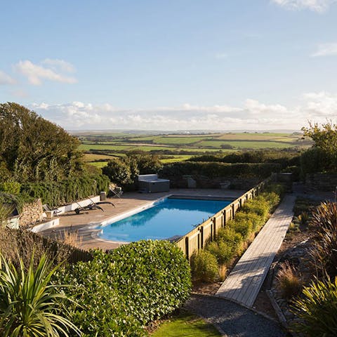 Spend long summer days relaxing by the shared outdoor pool