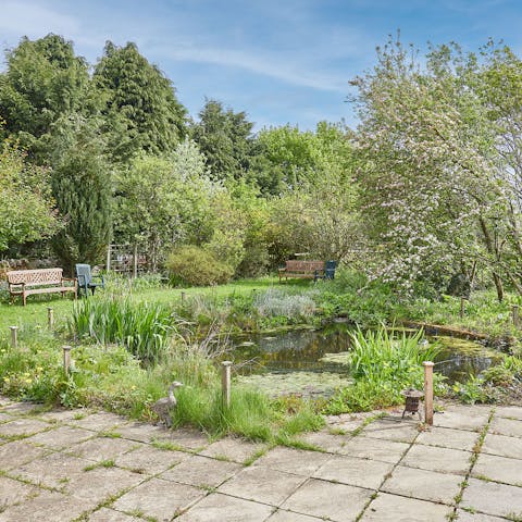 Walk around the gorgeous shared gardens on your doorstep, featuring an idyllic pond