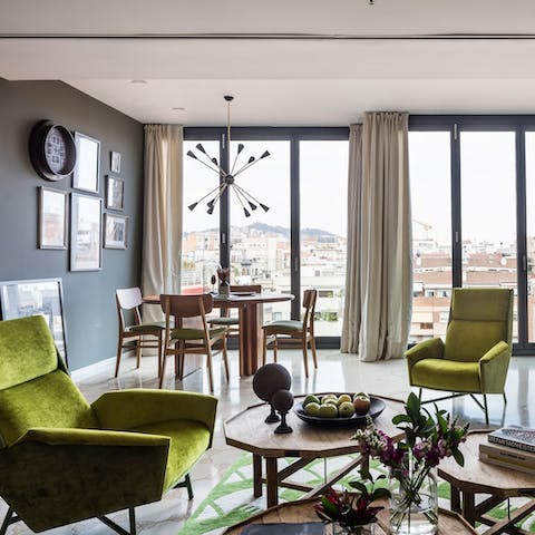 Read a book in the green velvet armchair or gaze at the Barcelona vistas