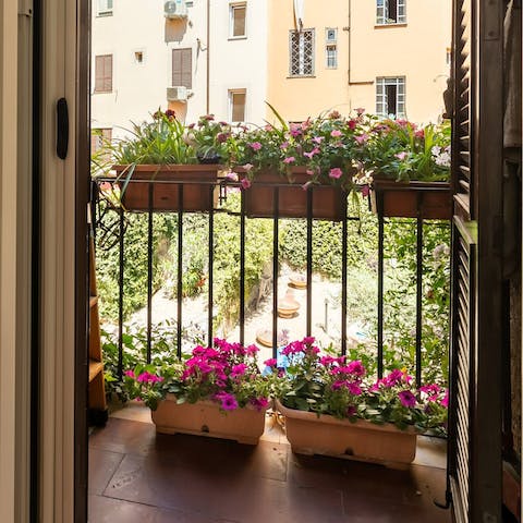 Step out to the sun-soaked balconette with a glass of chianti in hand