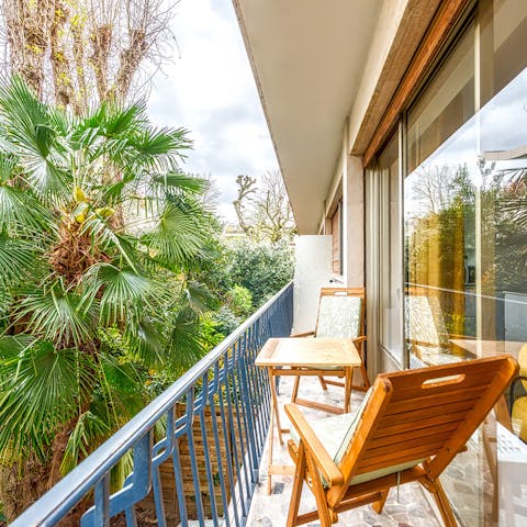 Take your morning coffee on the sunny balcony by the trees