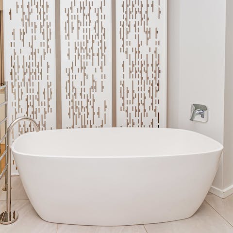 Run yourself a bubble bath in the free-standing tub after a day on your feet