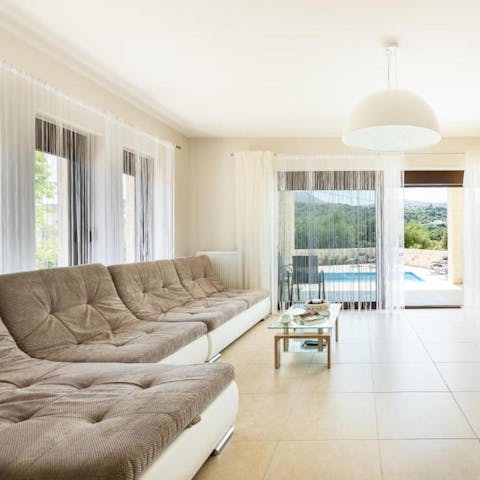 Recline on the velvety sofa as sunlight streams into the living room