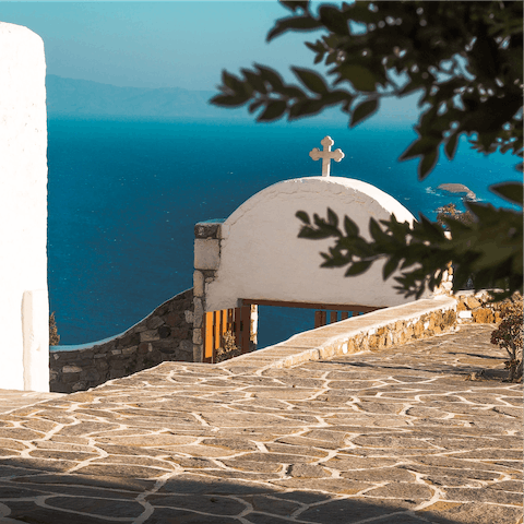 Discover the local Cycladic churches with Aegean views