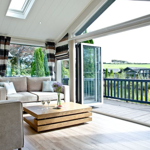Slide open the bifold doors to let the outside in 