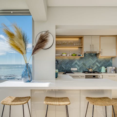 Enjoy breakfast at the sleek kitchen counter with one eye trained on the view to your left