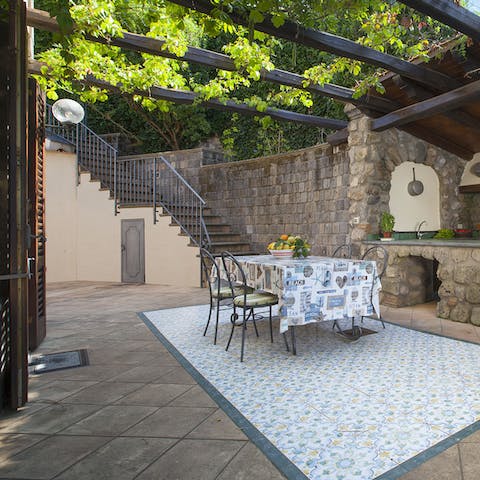 Dine alfresco under the welcome shade of the pergola