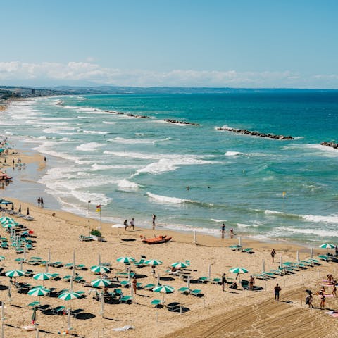 Sink your feet into the sand at Spiaggia Marina di Puolo beach, just 4km away