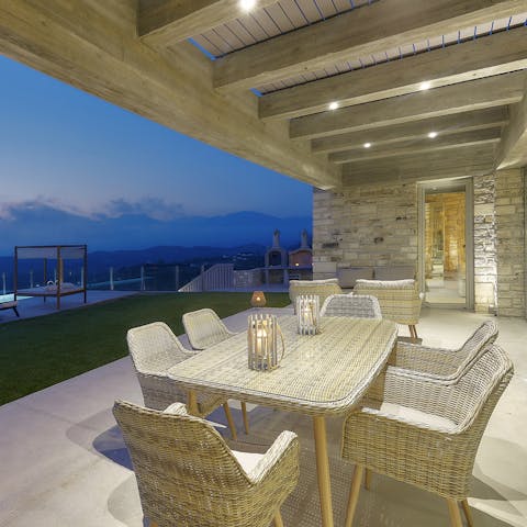 Dine alfresco by candlelight on the covered terrace