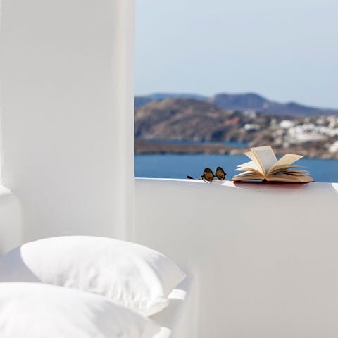 Read a book on the terrace as the waves crash below you