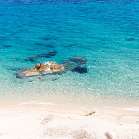 Dip your toes into the Aegean at Paralia Korfos, ten minutes away by car