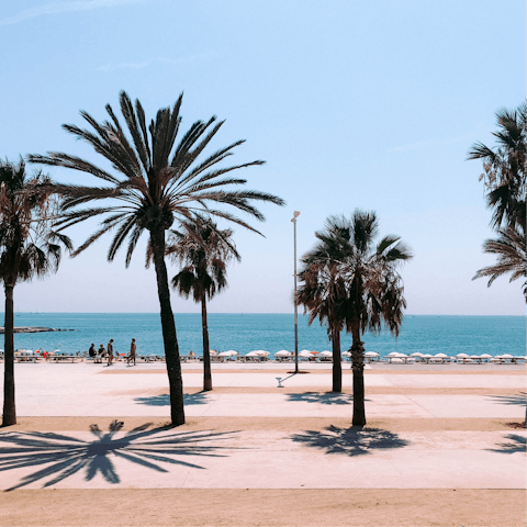 Spend a day relaxing on Barceloneta Beach, a twenty-five-minute walk or eight-minute drive from the apartment