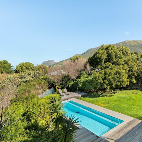 Cool off in the pool amid lush gardens