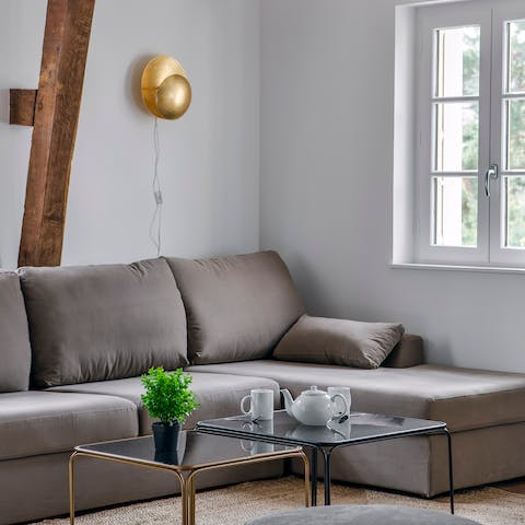 Lounge underneath the timber beams in the living area after a long day on your feet