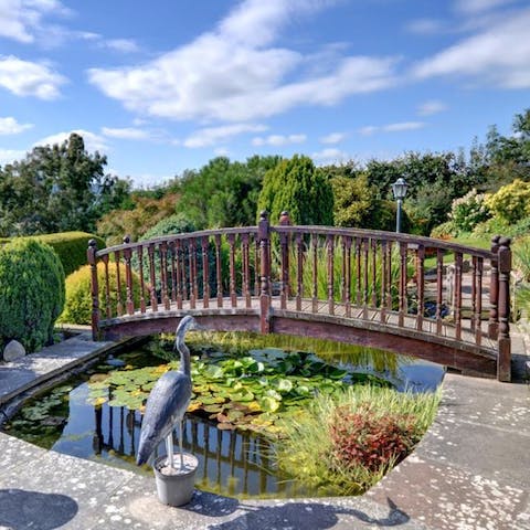 Stroll across the bridge and around the beautiful gardens