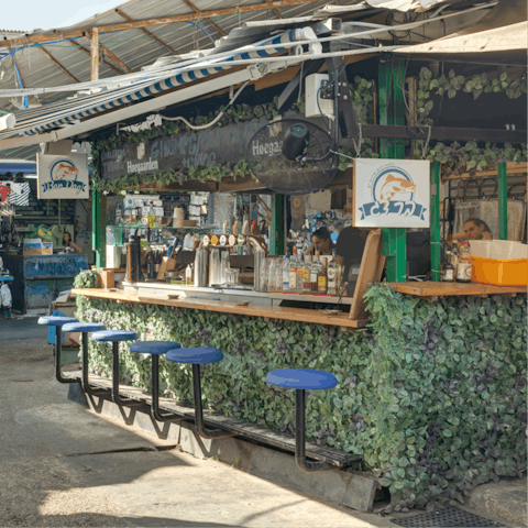 Shop at colourful Carmel Market and take in the scent of exotic spices