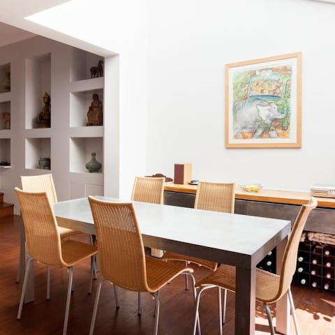 Gather friends around the well-lit dining table for home cooked feasts