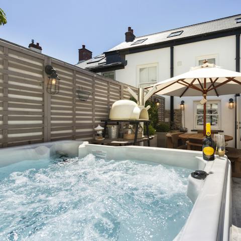 Unwind in the hot tub after a day out on the waves