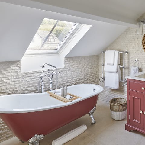 Unwind with a good book in the cherry red bathtub