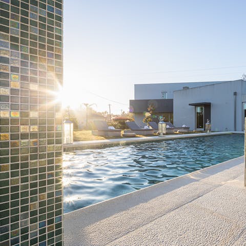 Unwind in the pool with its jacuzzi and waterfall features