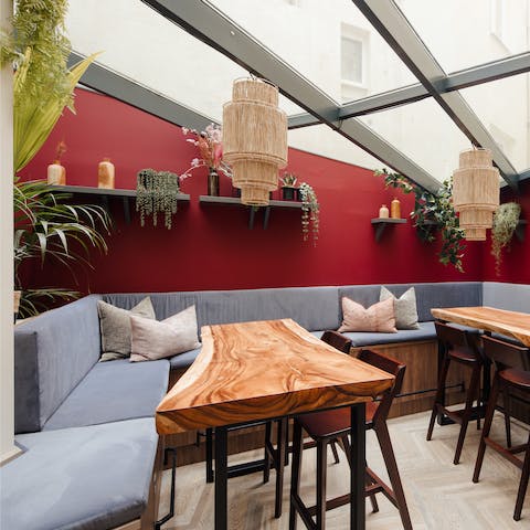 Enjoy a cup of coffee in the vibrant, communal lounge 