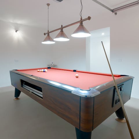 Play a few rounds of pool in the games room