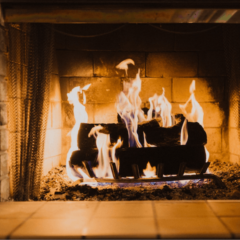 Spend chilly nights curled up by the glow of the fireplace