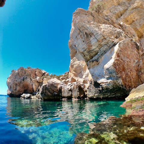 Explore the hidden coves and crystalline waters around Marbella