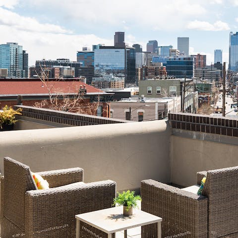 Enjoy a drink with city views on the rooftop terrace