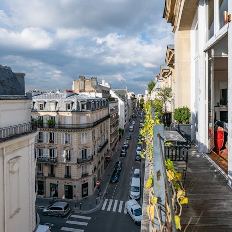 Sip a glass of wine on the balcony before dining in a nearby bistro