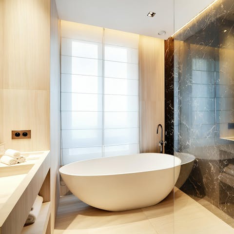 Have a long soak in the freestanding bath after a busy day in the City of Light