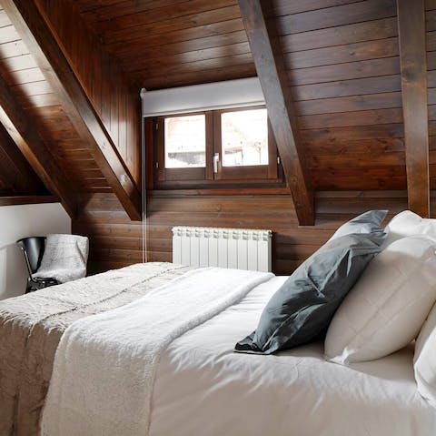 Rest up in the wood-panelled bedrooms