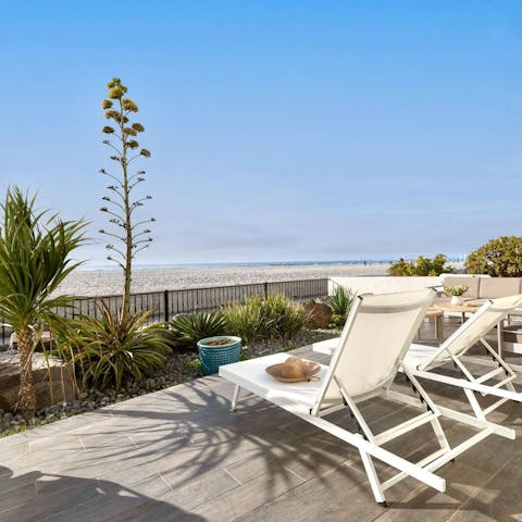 Take in the stunning views from the beachfront deck