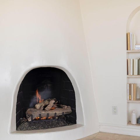 Gather around the adobe-style fireplace