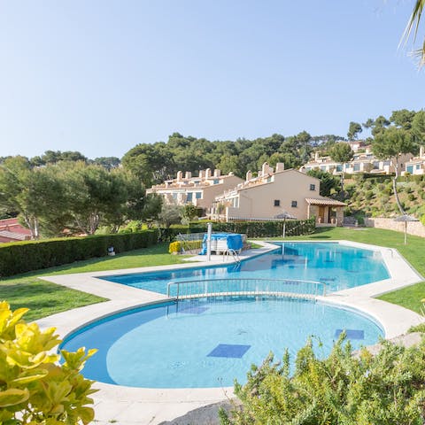 Soak up the Mediterranean sun by the communal pool