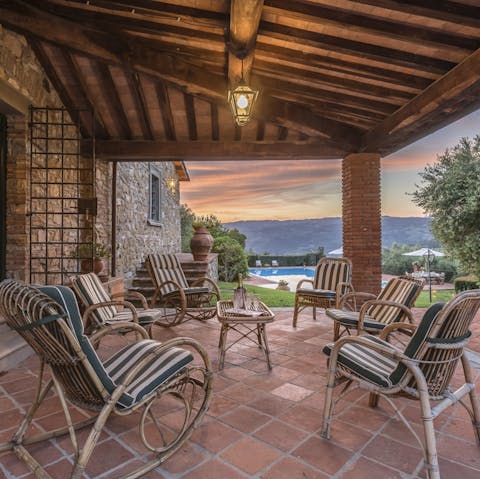 Sit out on the covered terrace as the sun goes down