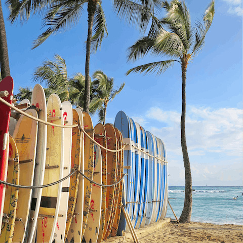 Relax at Waikiki beach as you take in the beautiful views of the coast, only a drive away