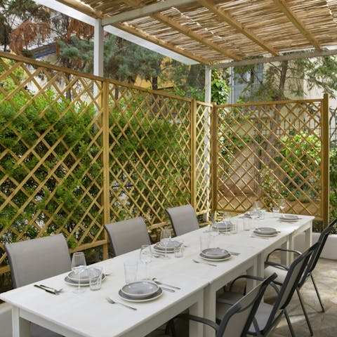 Enjoy alfresco dining in the garden's sun-shaded spot